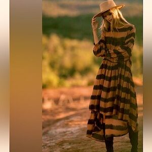 Anthropologie - long subtle shorter in front/longer in back
dress. Size - Small.